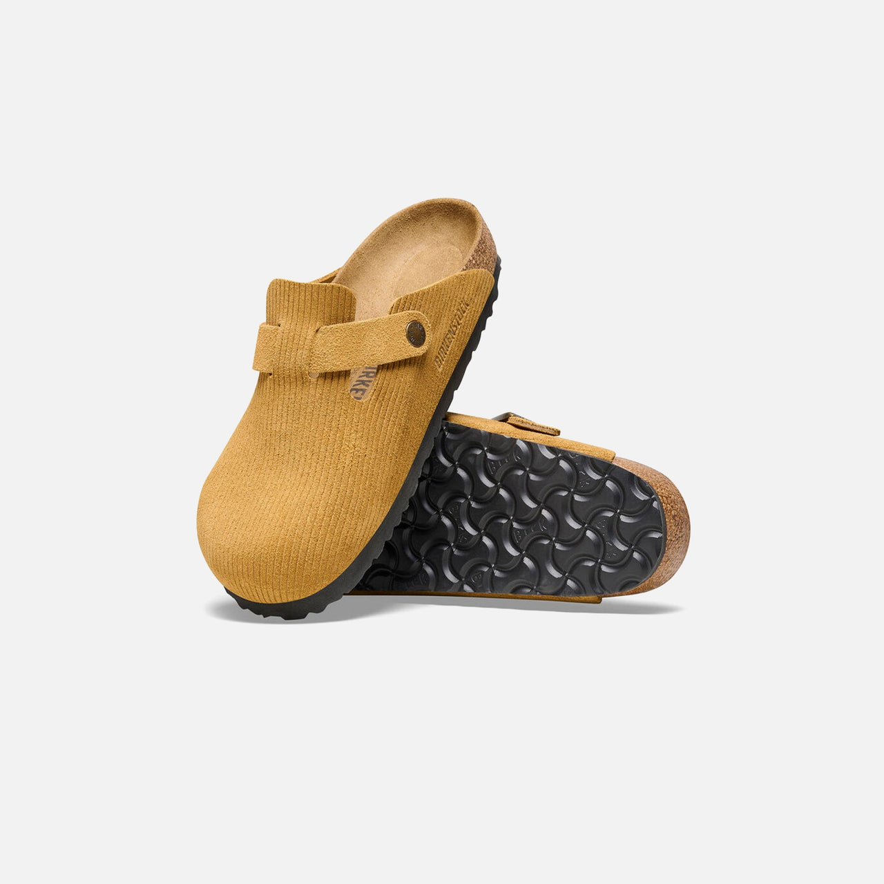 Brown Birkenstock Boston clogs made with high-quality corduroy and cork materials