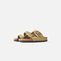 Thumbnail for  Close-up of the comfortable and stylish Birkenstock Women's Arizona Suede Taupe sandals in a natural outdoor setting