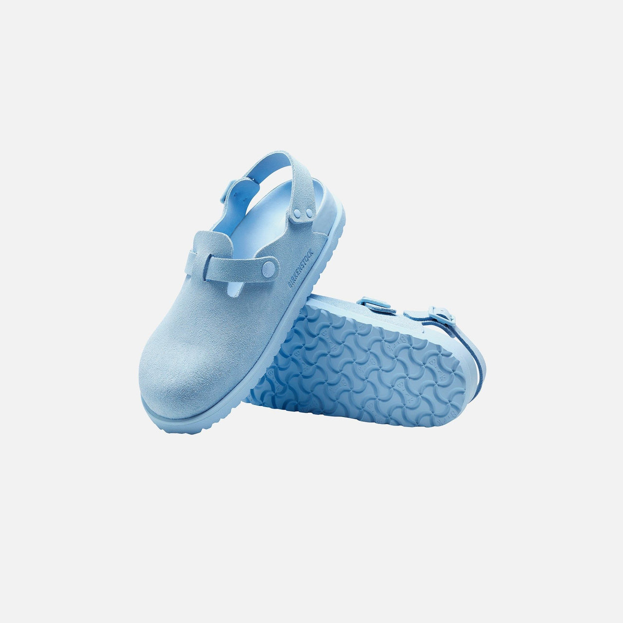 Pair of Birkenstock Tokio Suede Leather Powder Blue sandals on a wooden floor