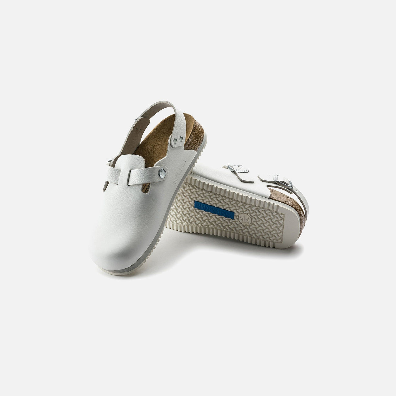 White leather Birkenstock clogs designed for maximum comfort and stability