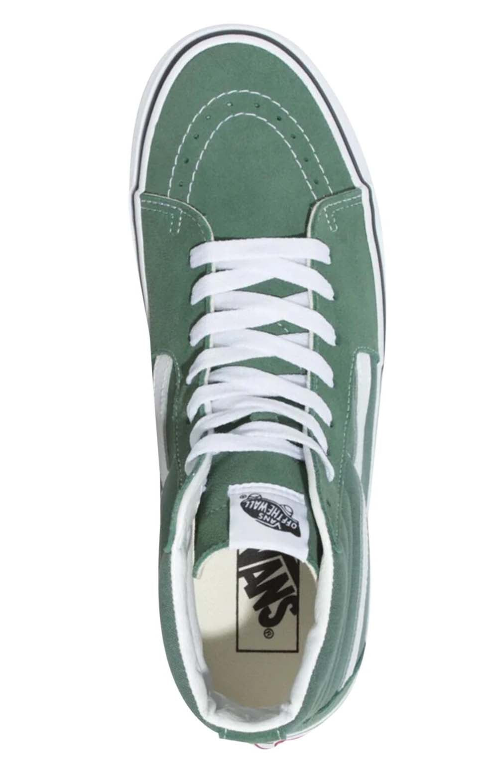 Close-up of (Q5NYQW) Color Theory Sk8-Hi Shoes in Duck Green, showcasing the textured canvas material and signature Vans stripe in contrasting color