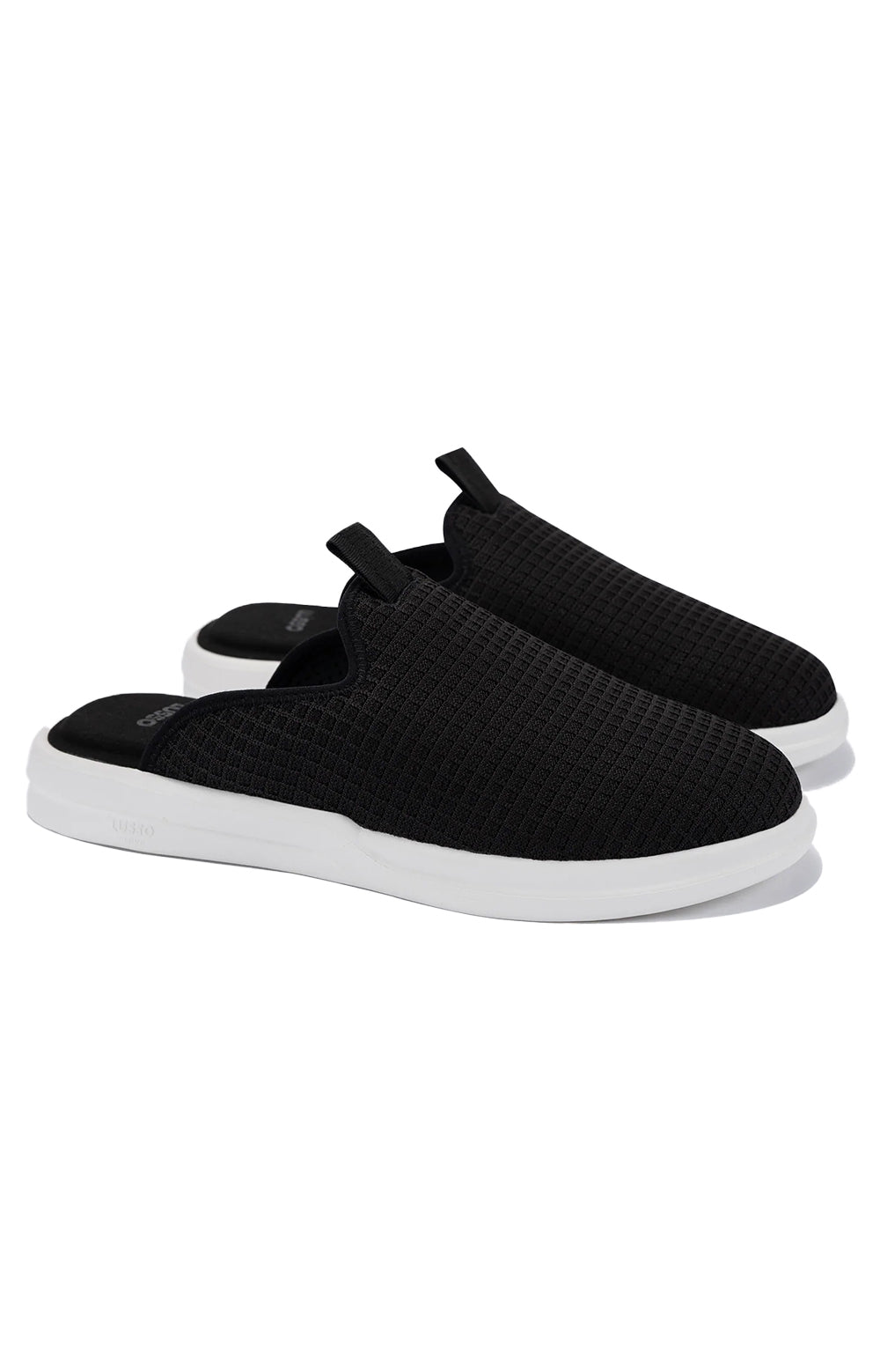 Pelli Waffle Slippers in Jet Black with a Lily White trim, perfect for cozy nights at home 