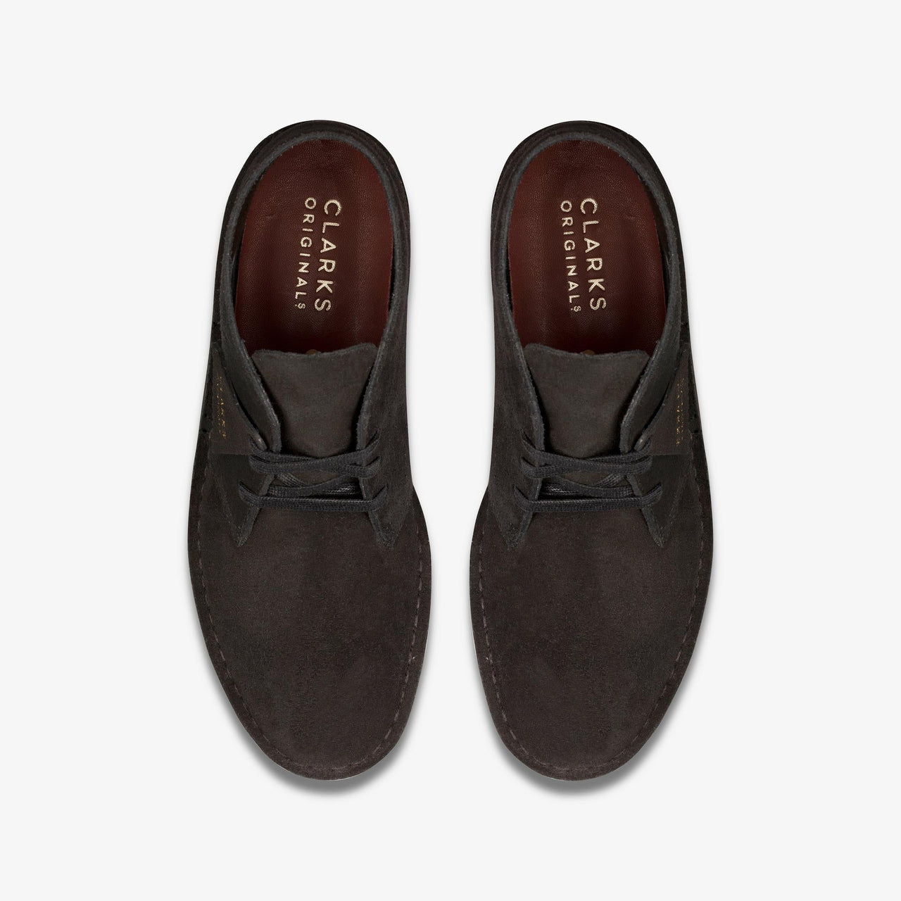 A close-up image of the classic men's Clarks Desert Coal shoes in black suede, featuring a comfortable and timeless design