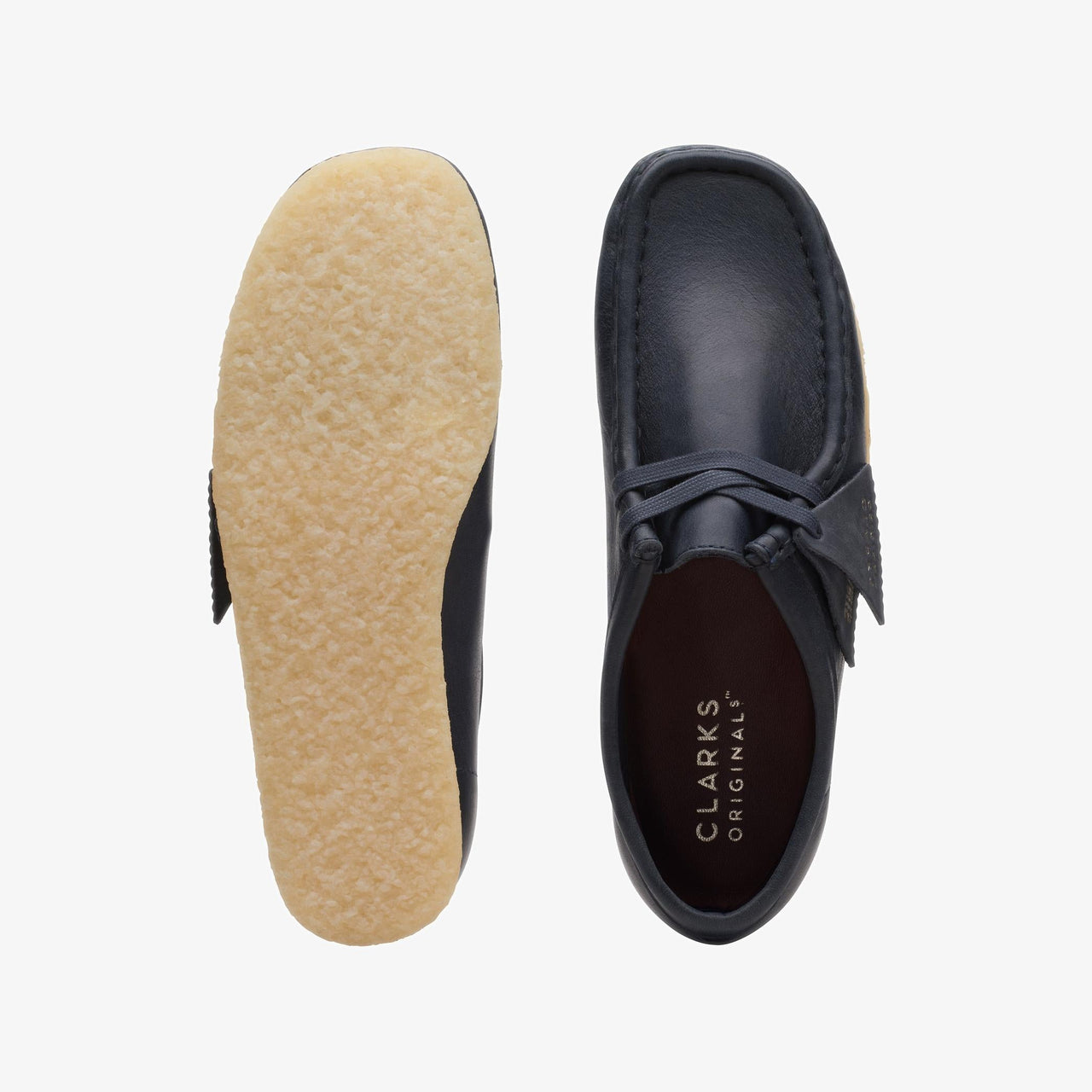 Pair of Womens Clarks Wallabee in Navy Leather, a timeless and versatile footwear option