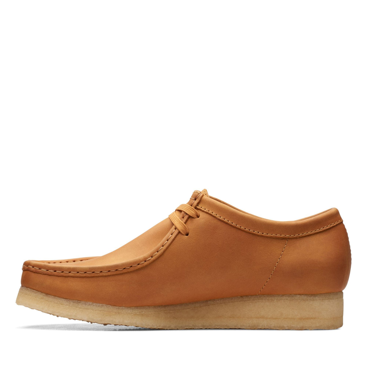 Men's feet wearing MENS CLARKS WALLABEE shoes in dark brown