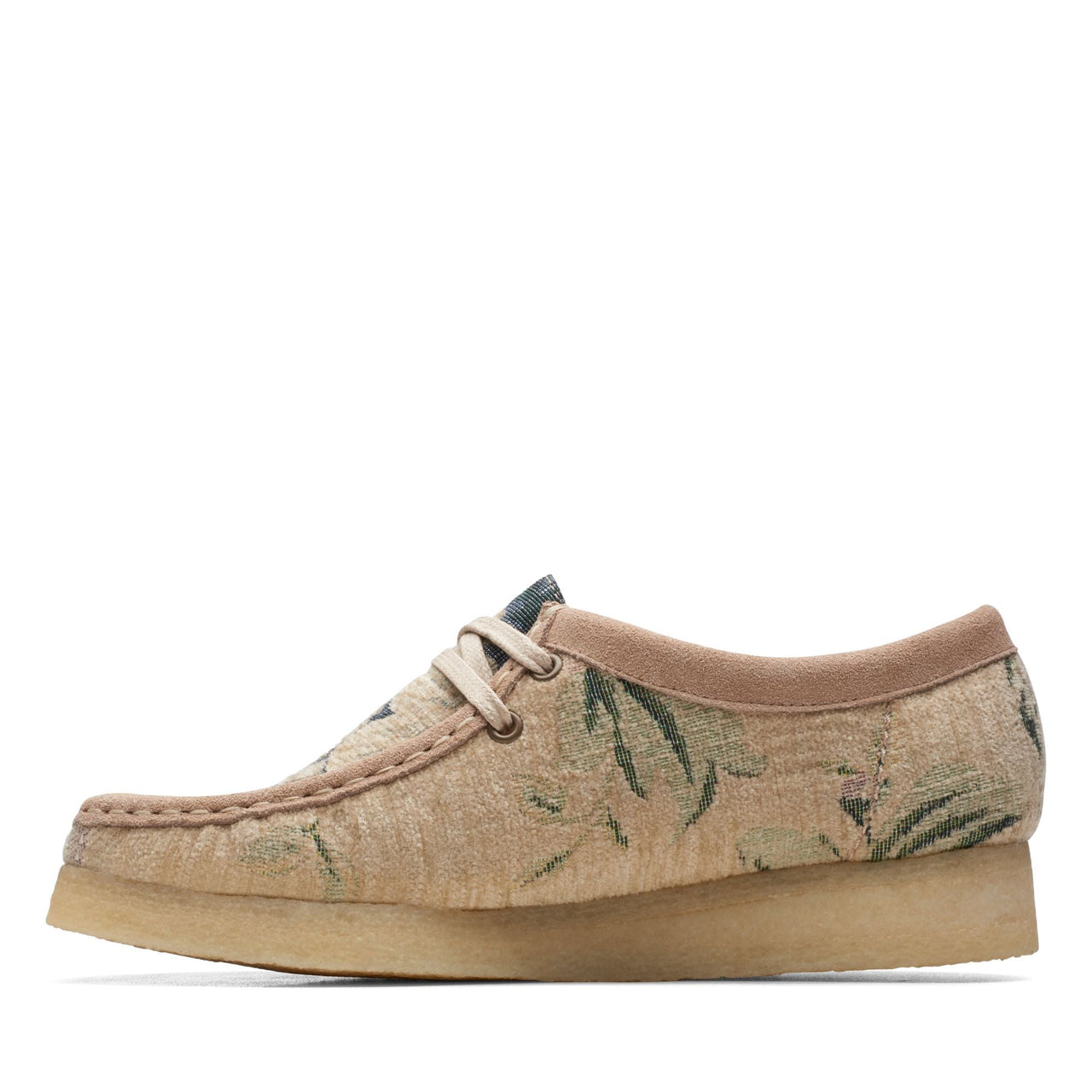 A side view of the WOMENS CLARKS WALLABEE shoes in a stylish and comfortable design