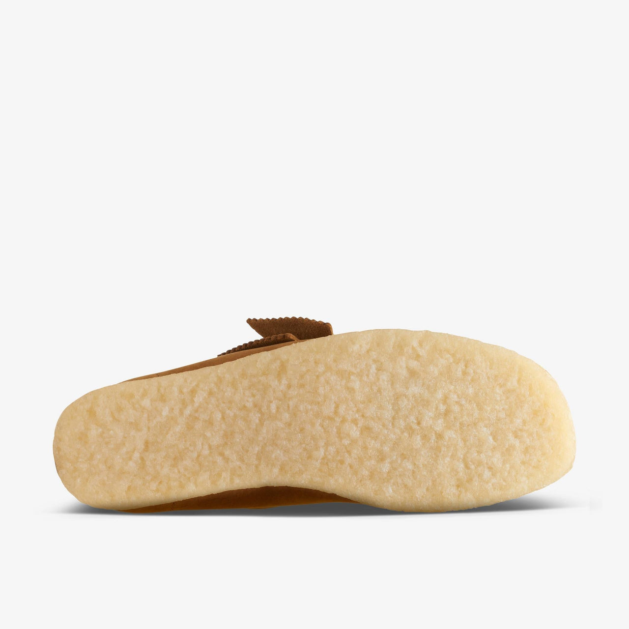 Side view of the [26169923] Womens CLARKS WALLABEE - BROWN shoes, displaying the iconic moccasin toe and signature crepe sole