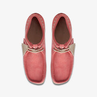 Thumbnail for A close-up image of the Mens Clarks Wallabee shoes in pink with intricate embroidery on the upper, showcasing the unique design and craftsmanship