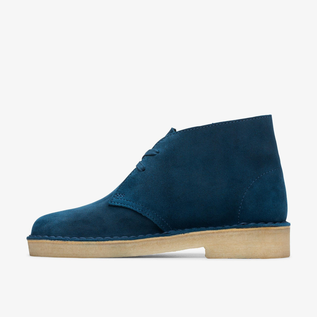 A close-up image of a pair of women's Clarks Desert Boots in deep blue suede, featuring a classic lace-up design and comfortable, stylish construction