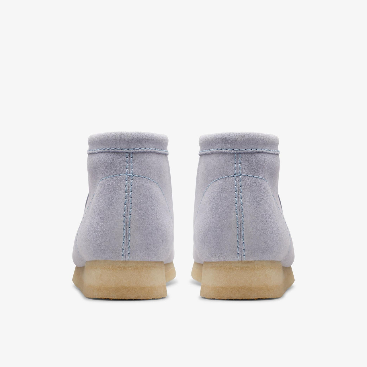 A pair of men's Clarks Wallabee boots in cloud grey suede, showcasing the stylish design and comfortable fit