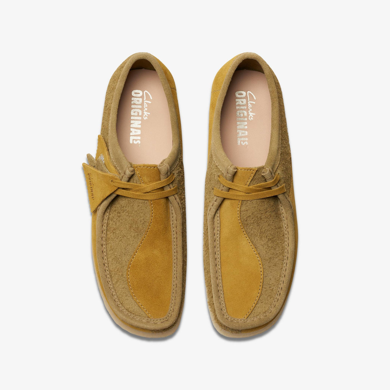 A high-quality image of the olive combi Mens Clarks Wallabee shoes, perfect for a stylish and comfortable addition to any man's wardrobe