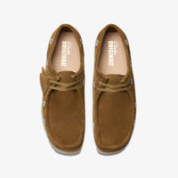 Thumbnail for Fashionable Mens Clarks Wallabee Dark Olive Emb Shoes Styled with Jeans