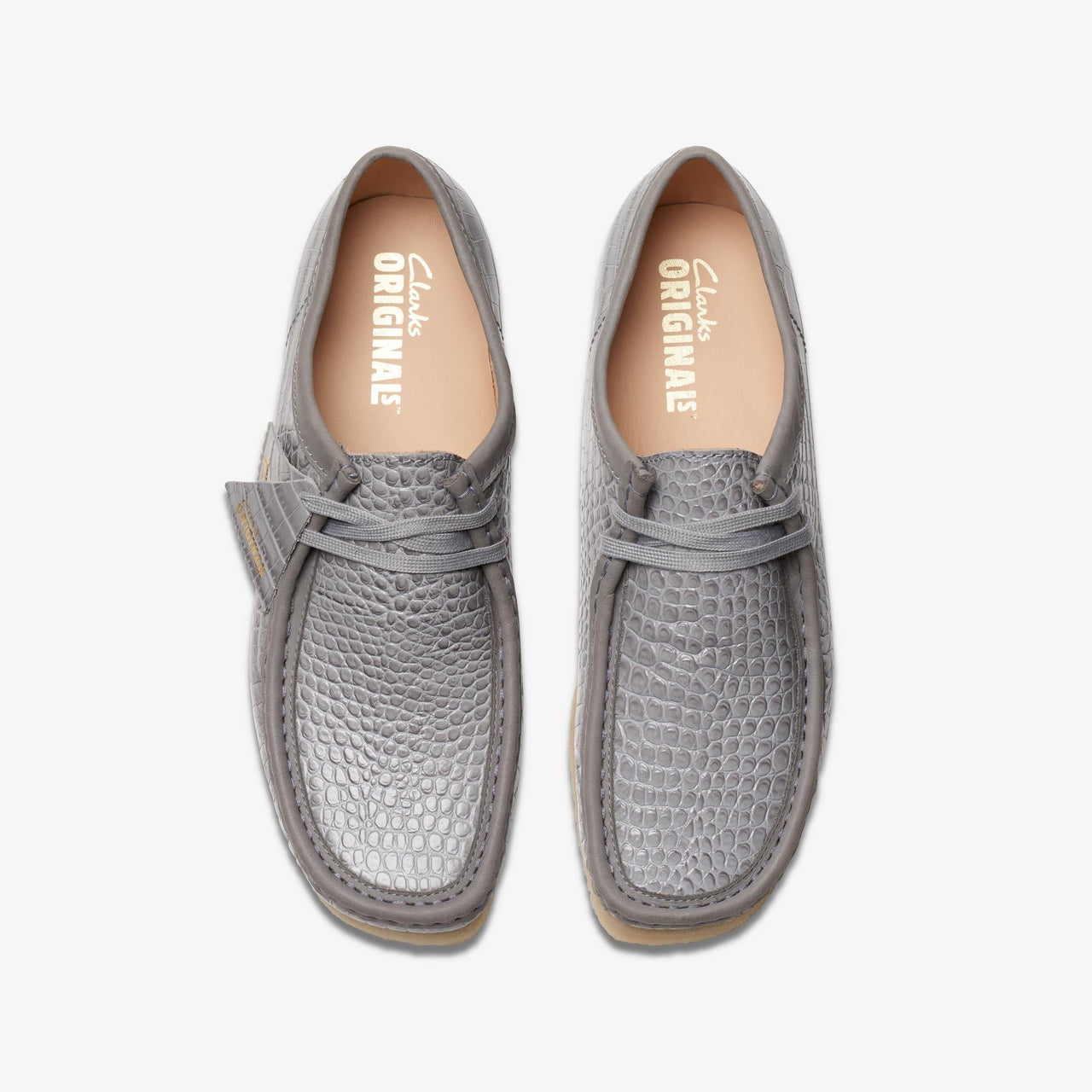 Durable mens Clarks Wallabee in a fashionable grey crocodile finish