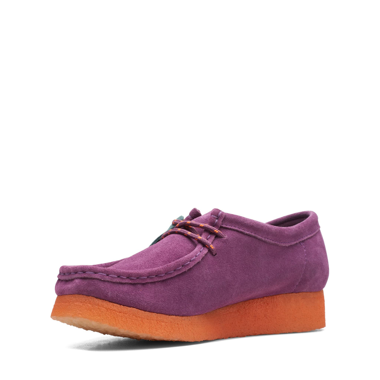 Pair of womens Clarks Wallabee shoes in purple suede with a white sole