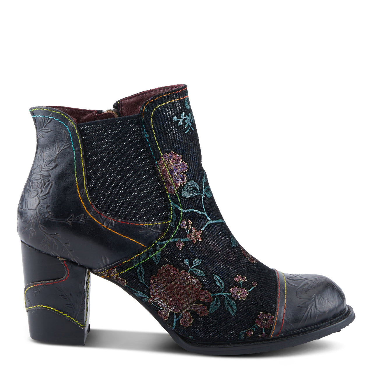 Pair of L'ARTISTE CEJA BOOTS in a rustic setting, perfect for outdoor adventures