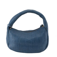 Thumbnail for Woman wearing L'ARTISTE HB-WOVEN HANDBAG as a crossbody bag