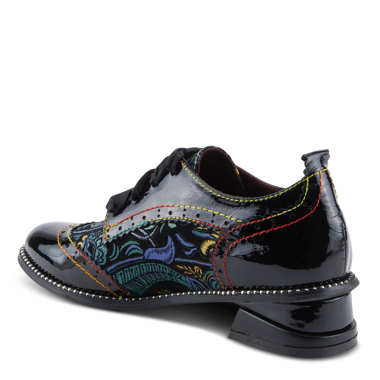 A close-up image of the handcrafted L'ARTISTE PRADEEP SHOES, featuring intricate floral detailing on genuine leather