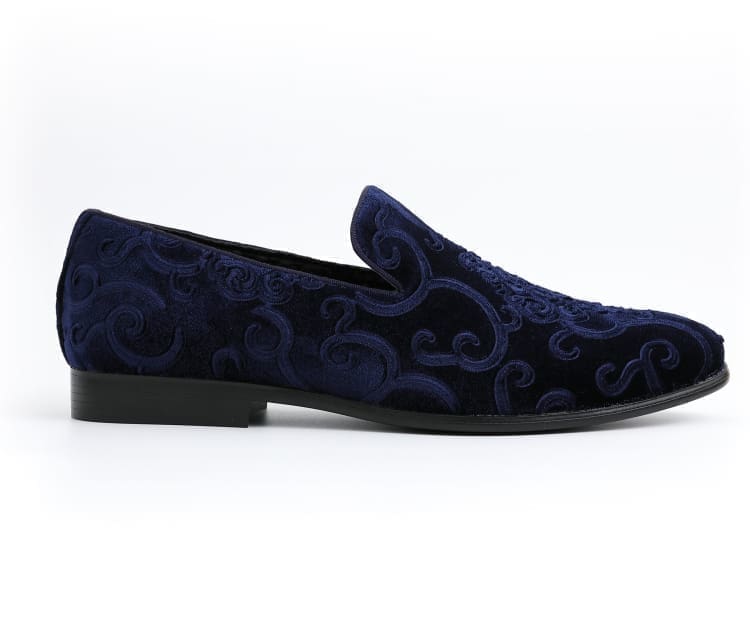 Alt text: Navy blue Bryant sneakers, featuring a low-top design and white rubber sole