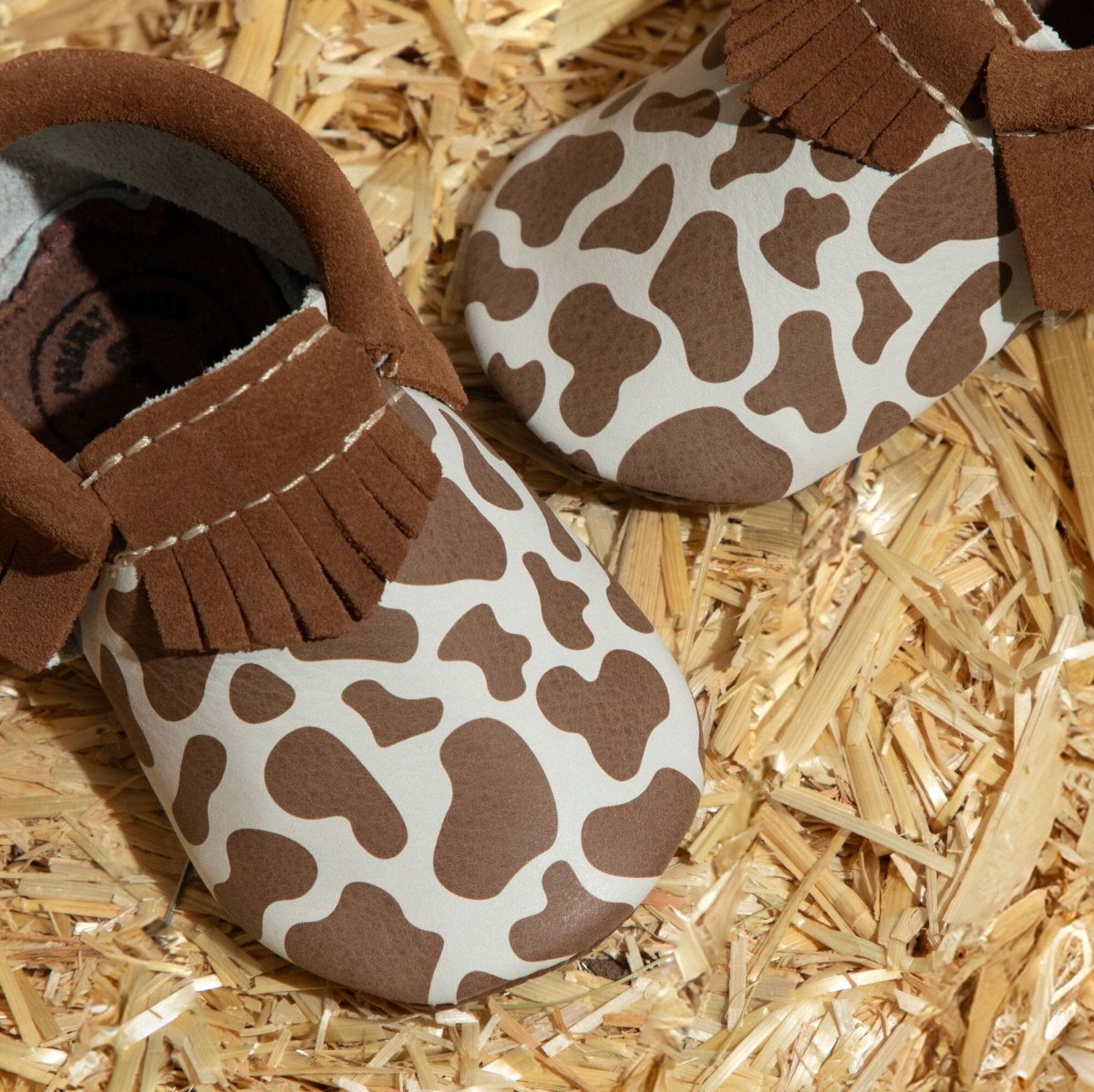 Suede Cow Print Moccasin Baby Shoe Moccasin by Freshly Picked – Don't Panic Shoes