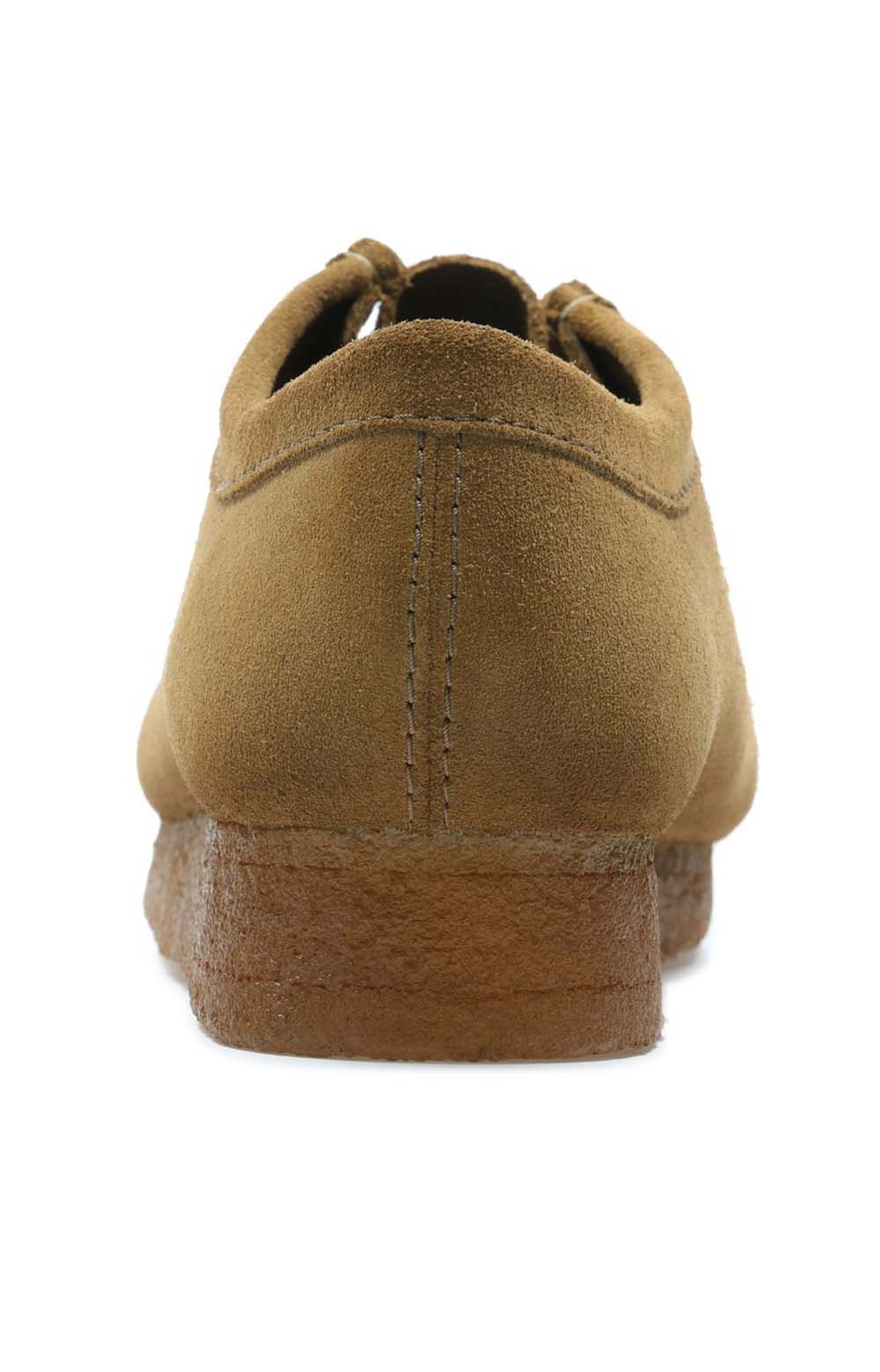 Men's feet wearing the Clarks Originals Wallabee Low Men's Cola Suede 26155518 shoe