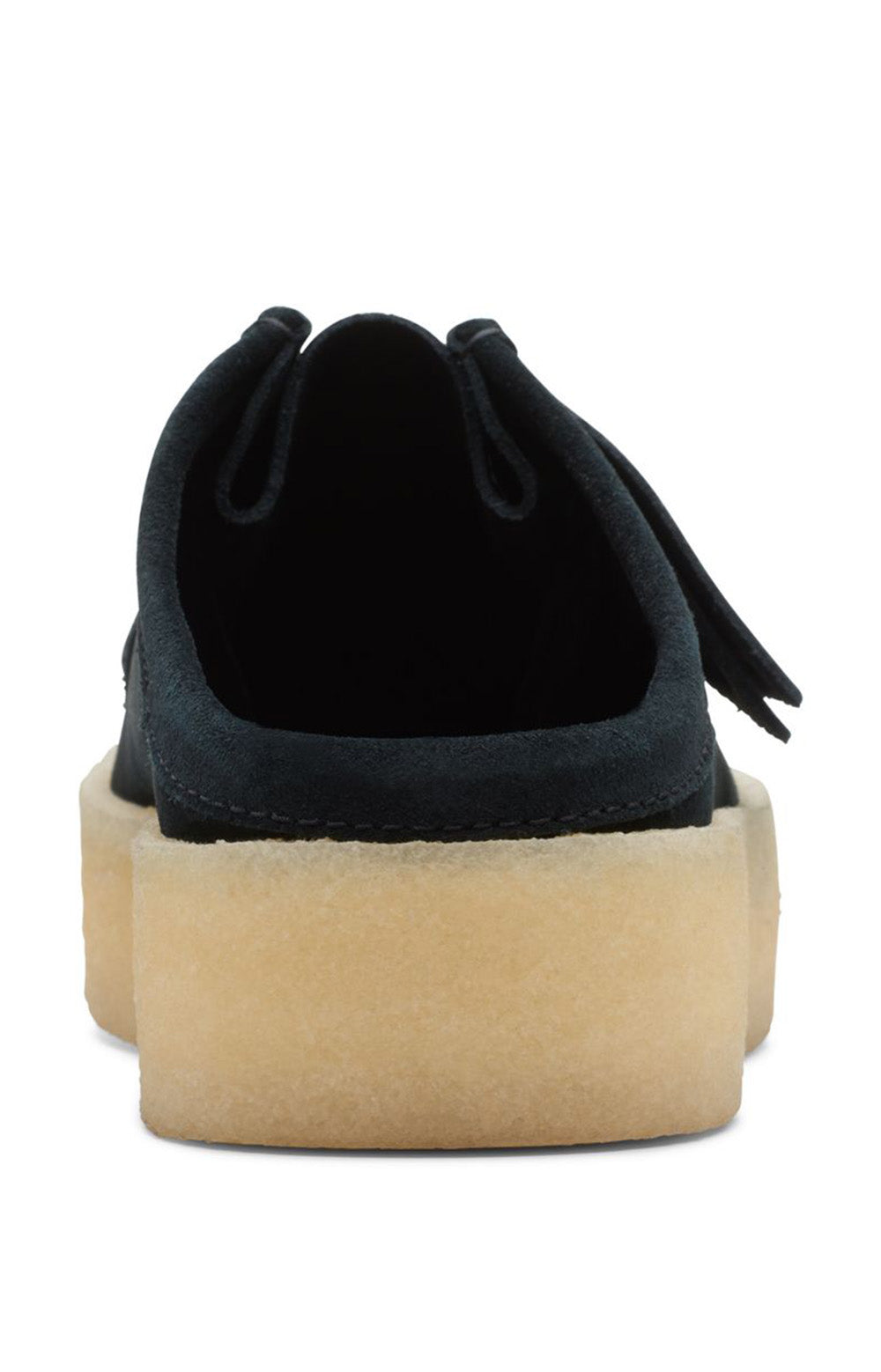 A person holding the Clarks Originals Wallabee Cup Low Men's Black Suede 26167285 shoes to showcase their supple suede and classic design
