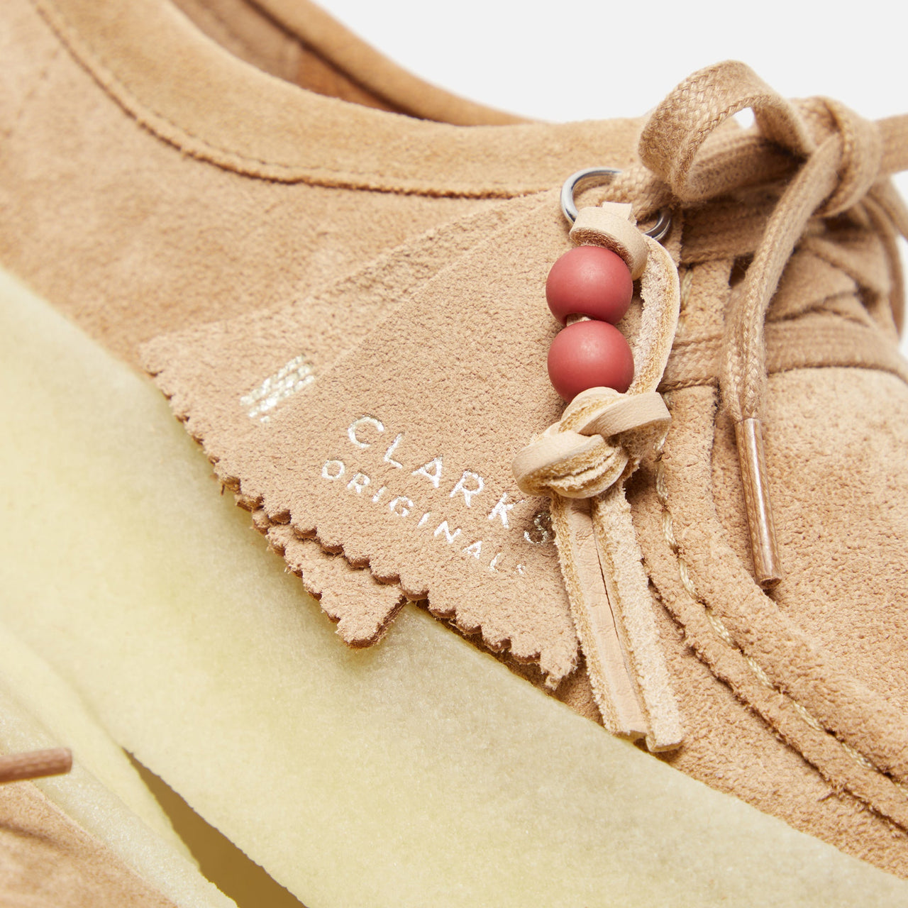 Pair of Clarks Originals Wallabee Cup Women's Warm Beige Suede 261732524 shoes in a natural setting